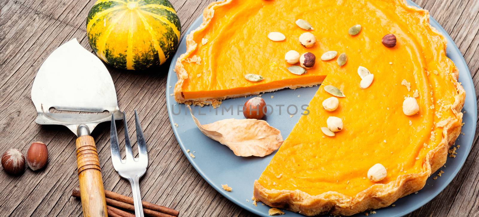 Pumpkin pie with nut and spice on retro background.Traditional American pumpkin pie