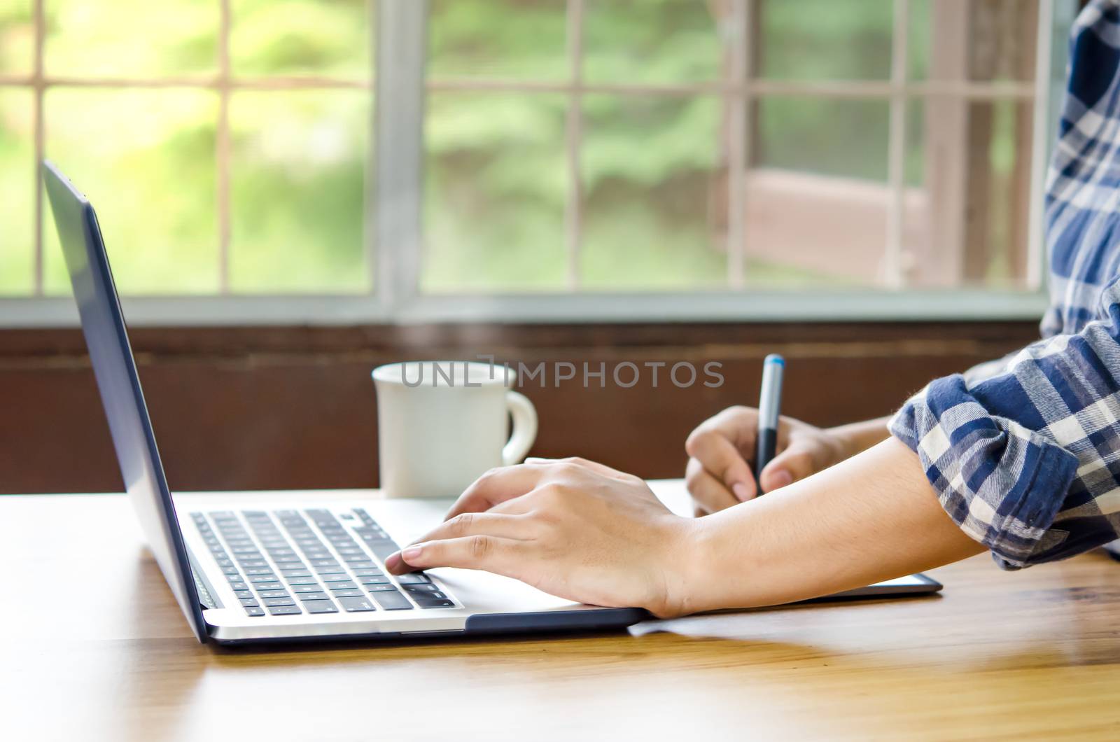 businesswoman using laptop by rakratchada