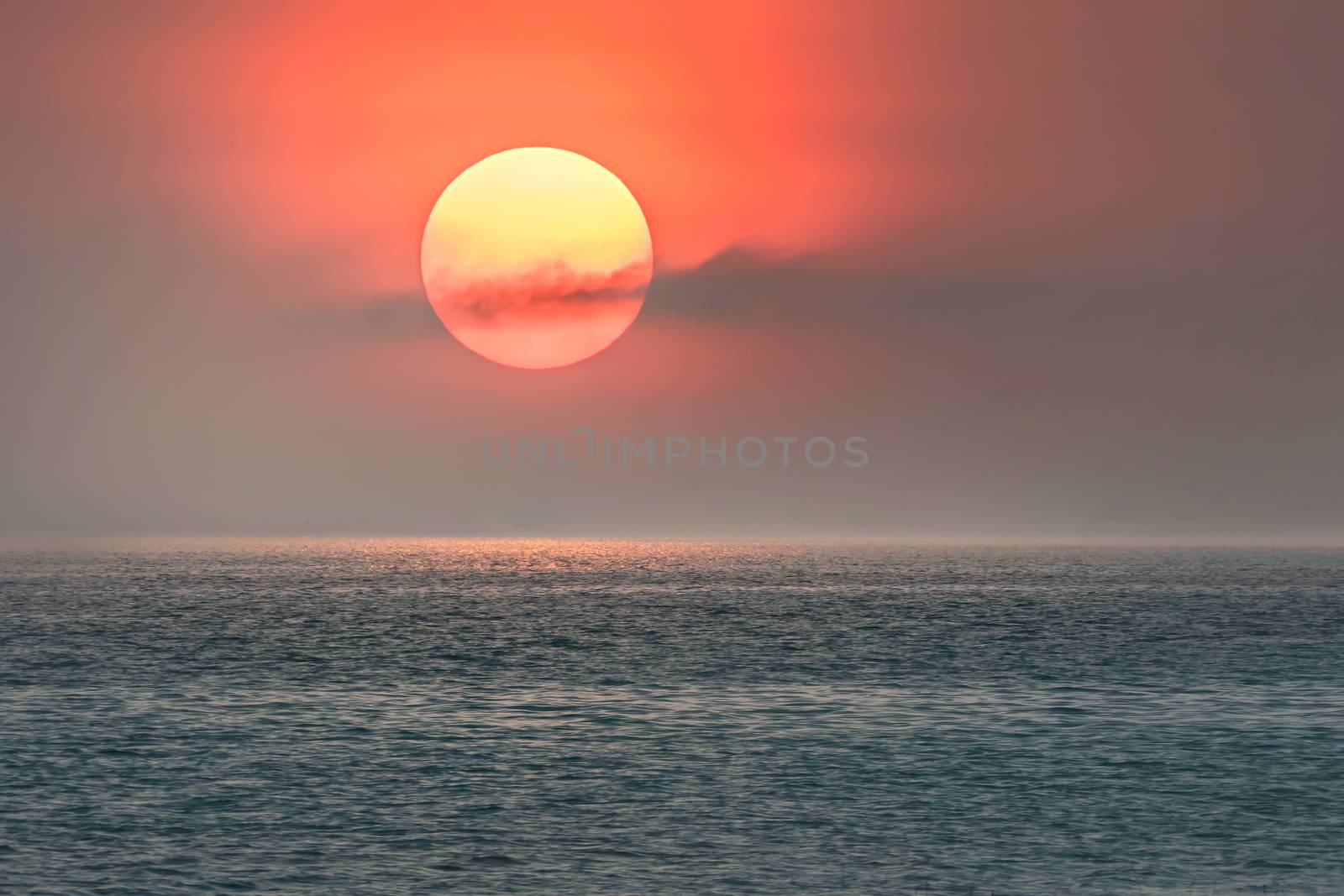 Beautiful scence of big sun on sky over the sea