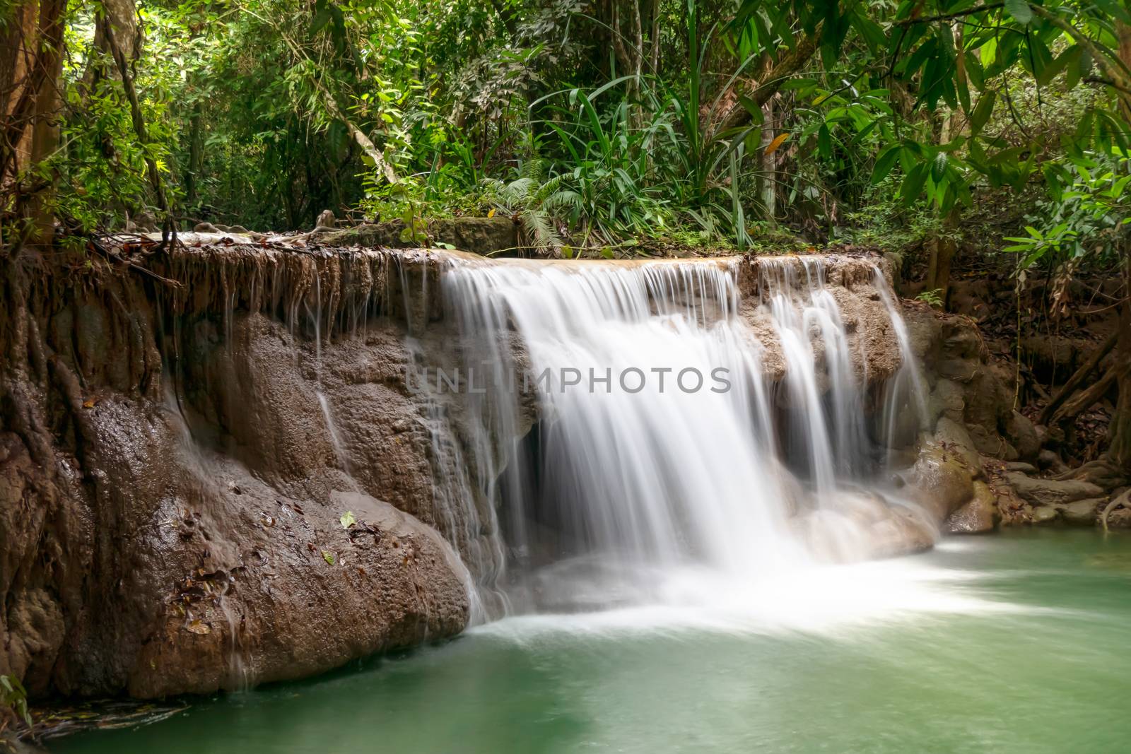 Fresh waterfall in rainforest at National Park, Thailand.