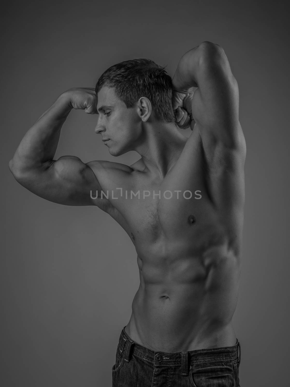 Muscular and fit young man posing shirtless