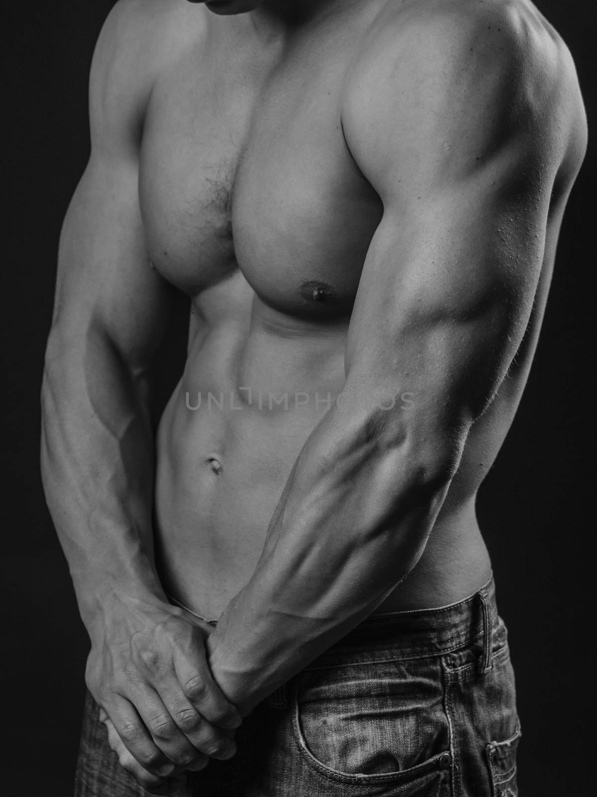 Muscular and fit young man posing shirtless