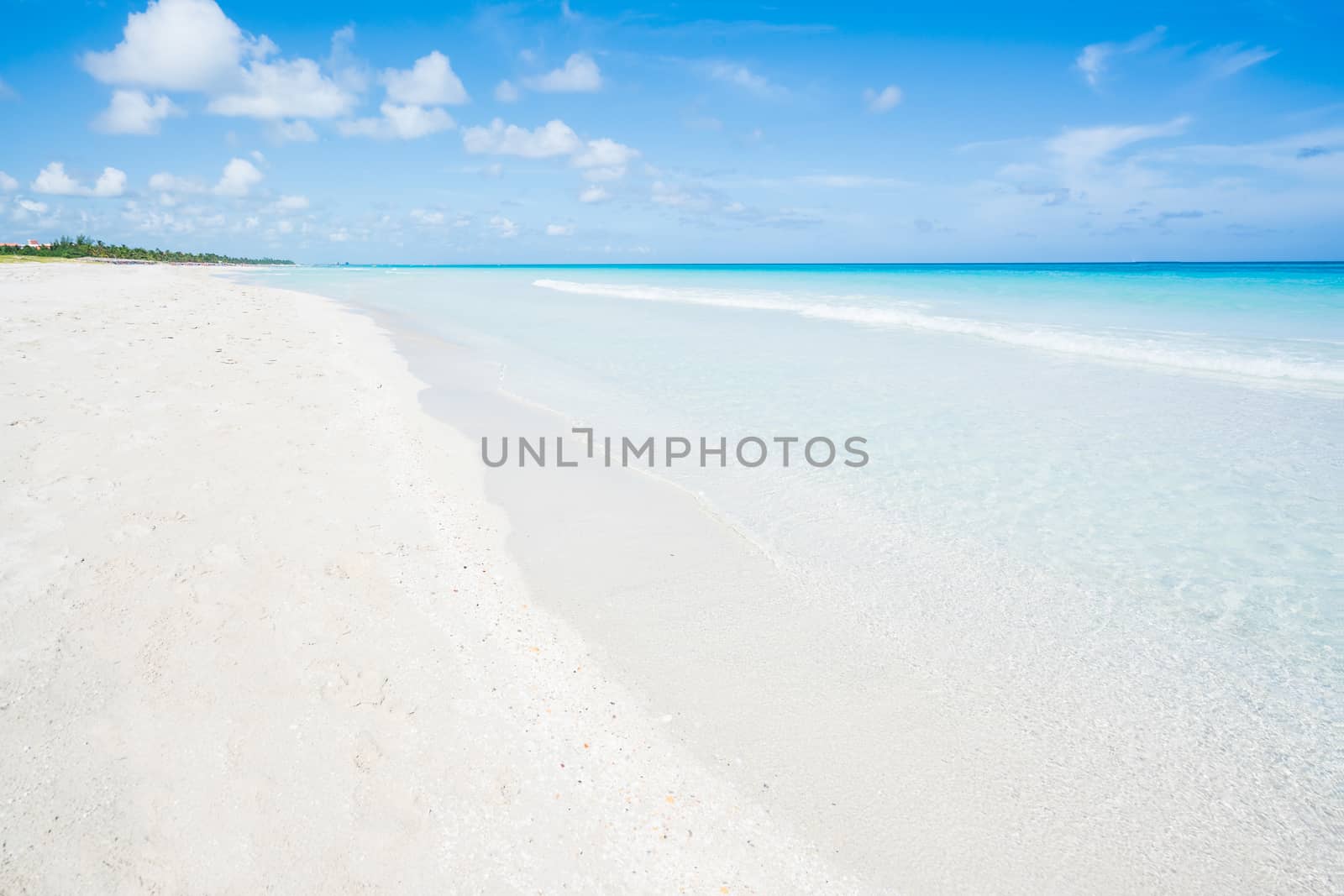 Awesome beach of Varadero during a sunny day, fine white sand and turquoise and blue Caribbean sea,sky with clouds,Cuba.