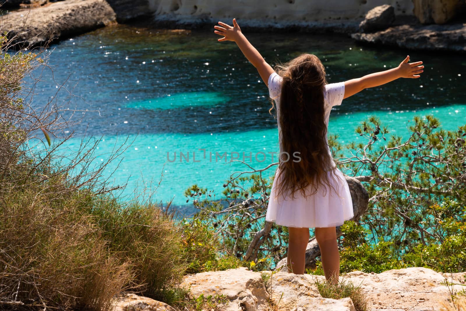 Opened arm girl enjoying the sea view in Mallorca by Lordignolo