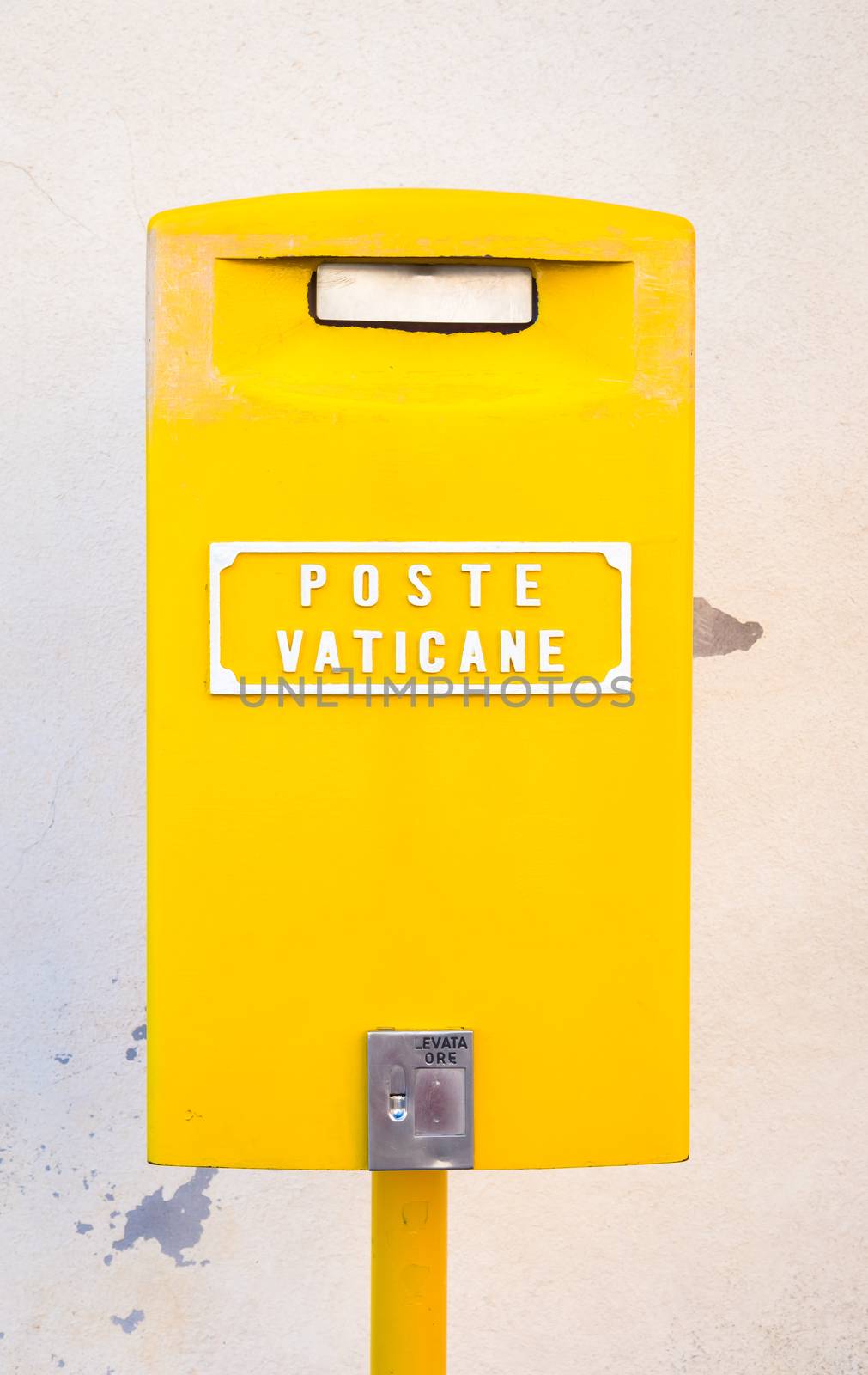 Detail of the traditional yellow post box in Vatican City, Rome