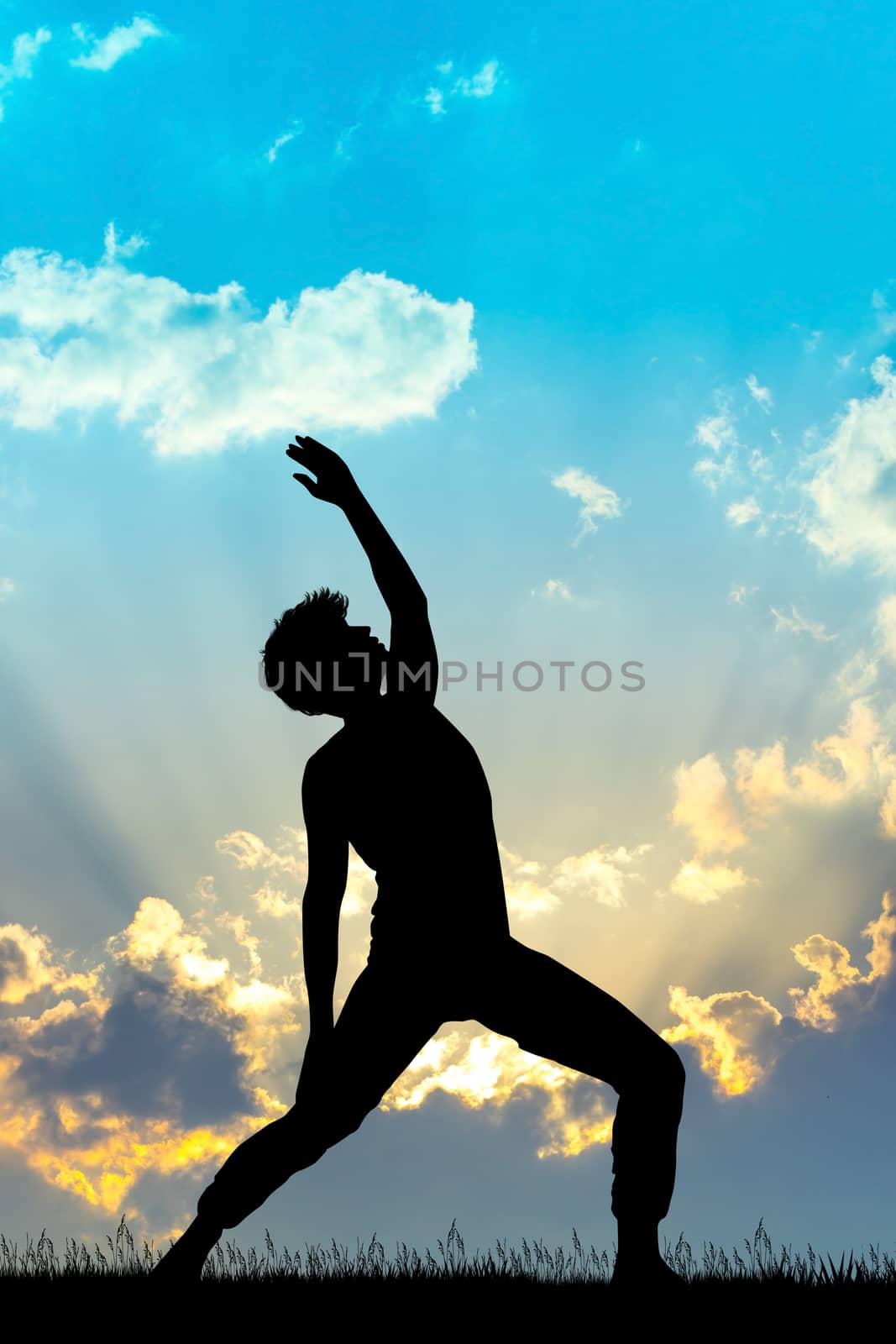 illustration of man does exercises at sunset