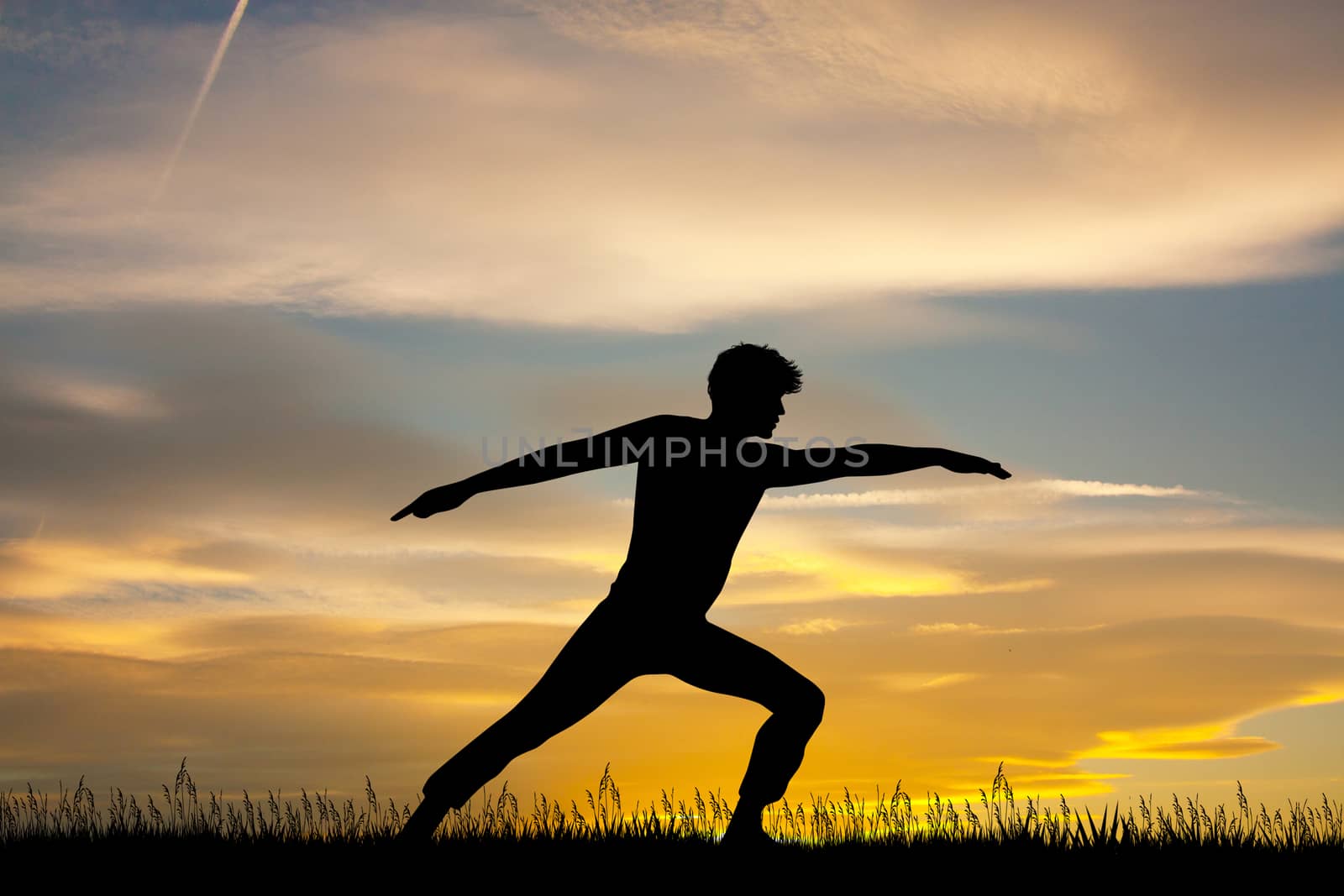 man is stretching at sunset by adrenalina