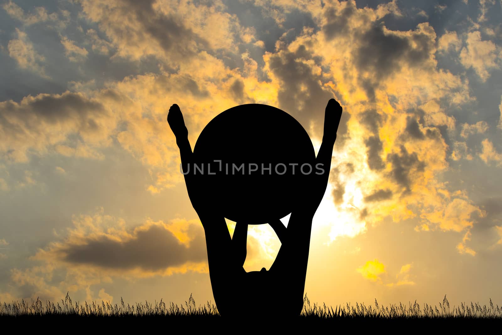 woman with pilates ball at sunset by adrenalina