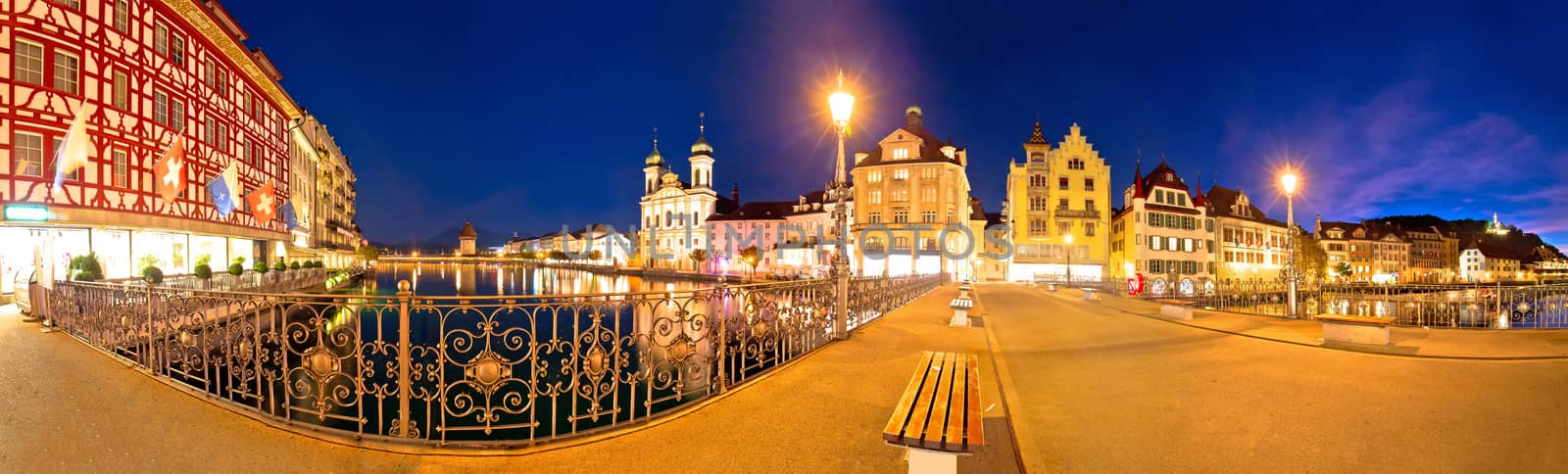 Luzern panoramic evening view of famous landmarks and Reuss river, central Switzerland