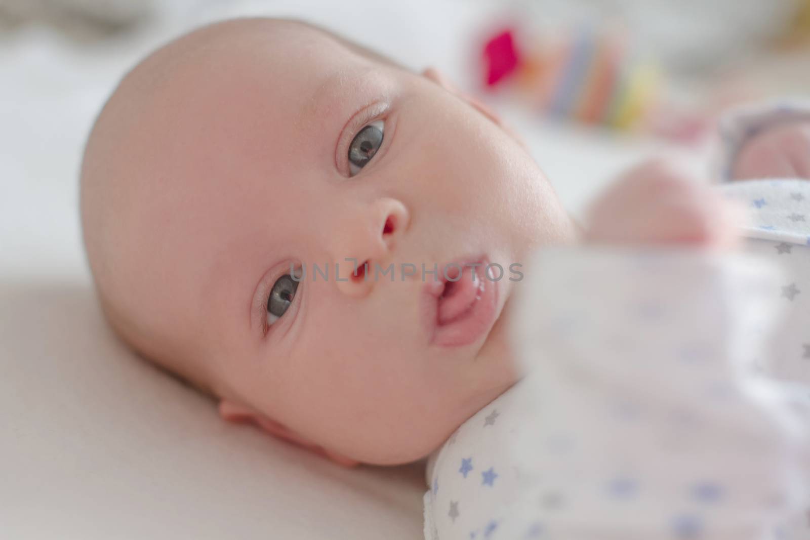 One month baby boy close-up showing tongue by Angel_a