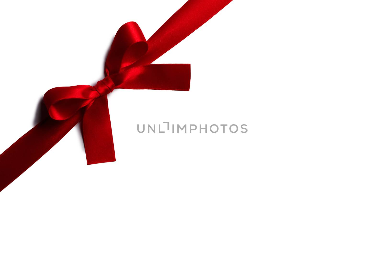 Red gift bow isolated on white background