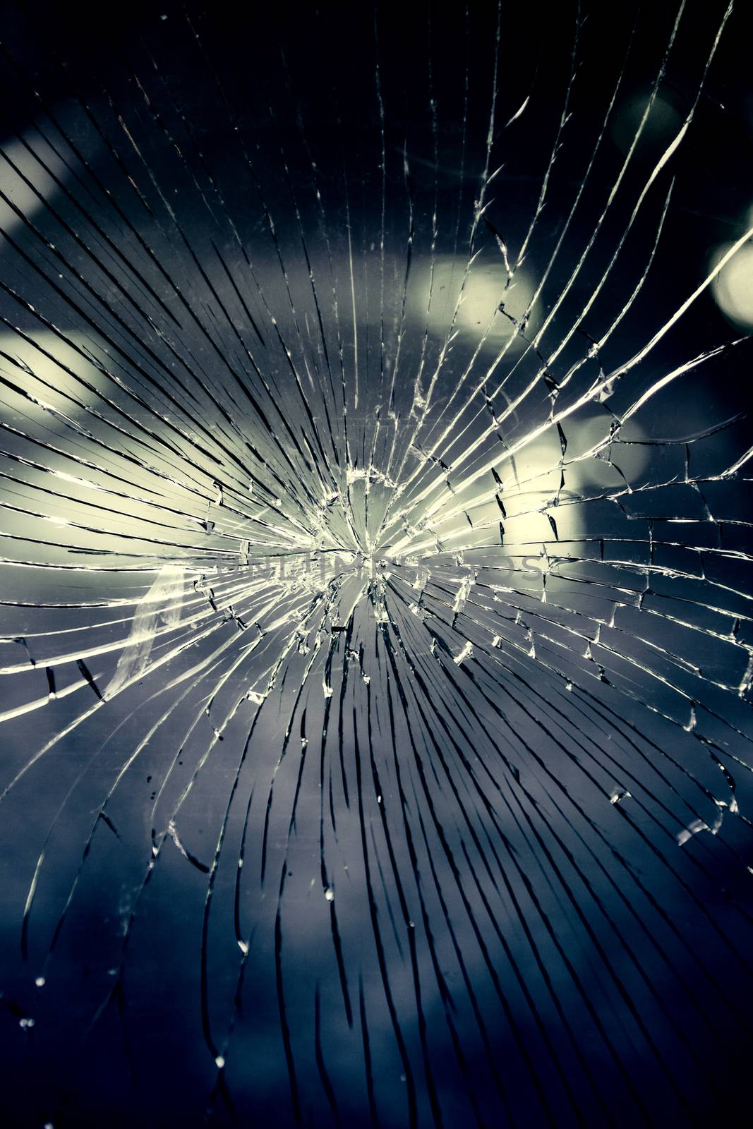 Broken and cracked glass, detail of vandalism and violence
