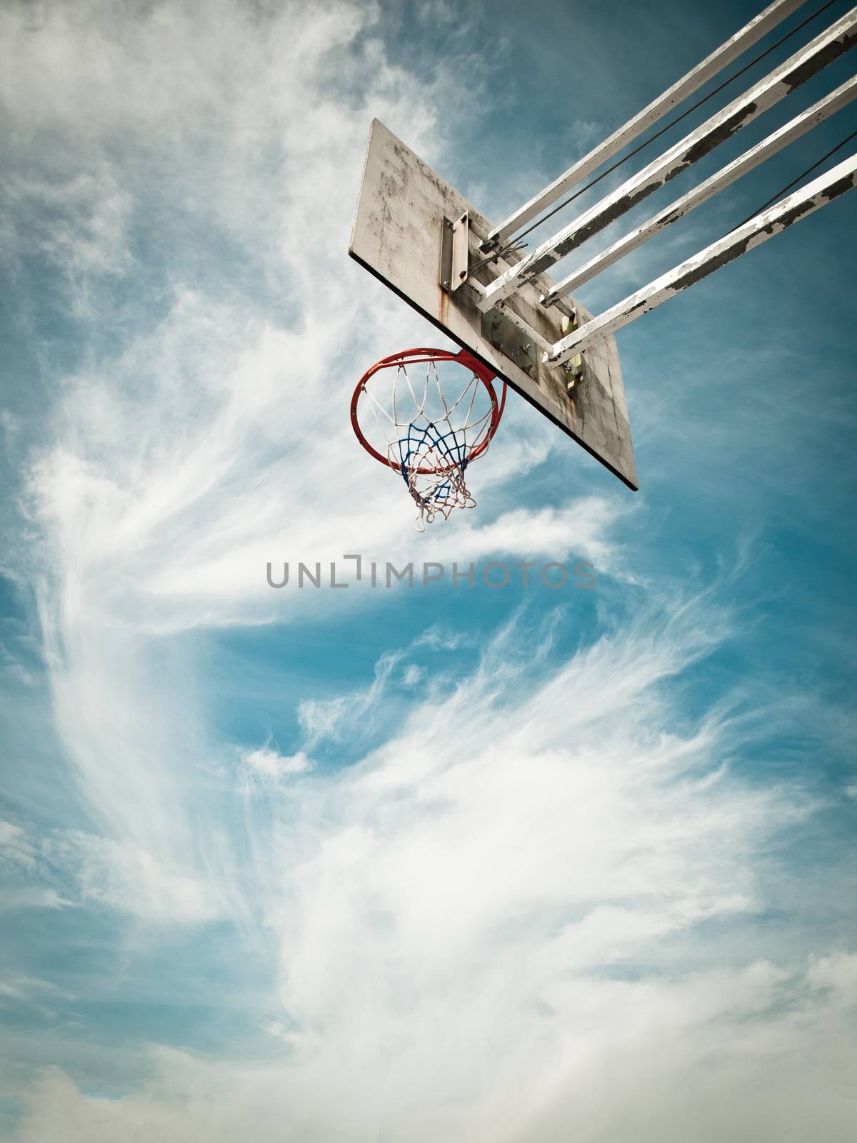 Basketball cest against a blue sky