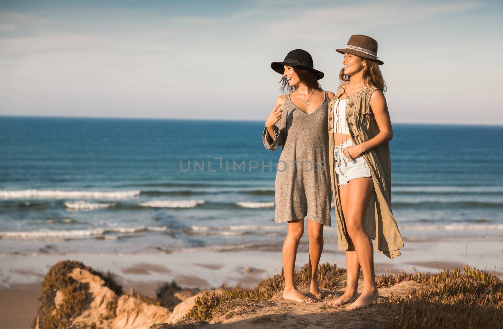 Two best friends near the coastline having fun on a beautiful summer day