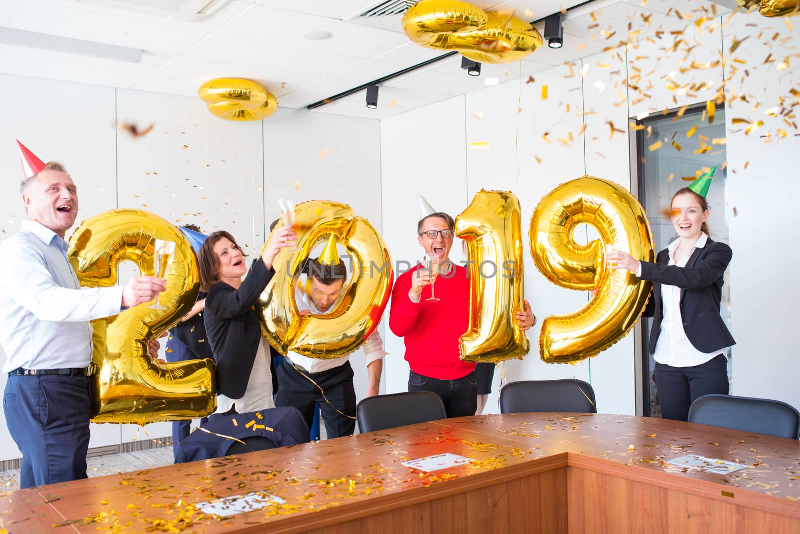 Business people celebrating 2019 New Year at office party