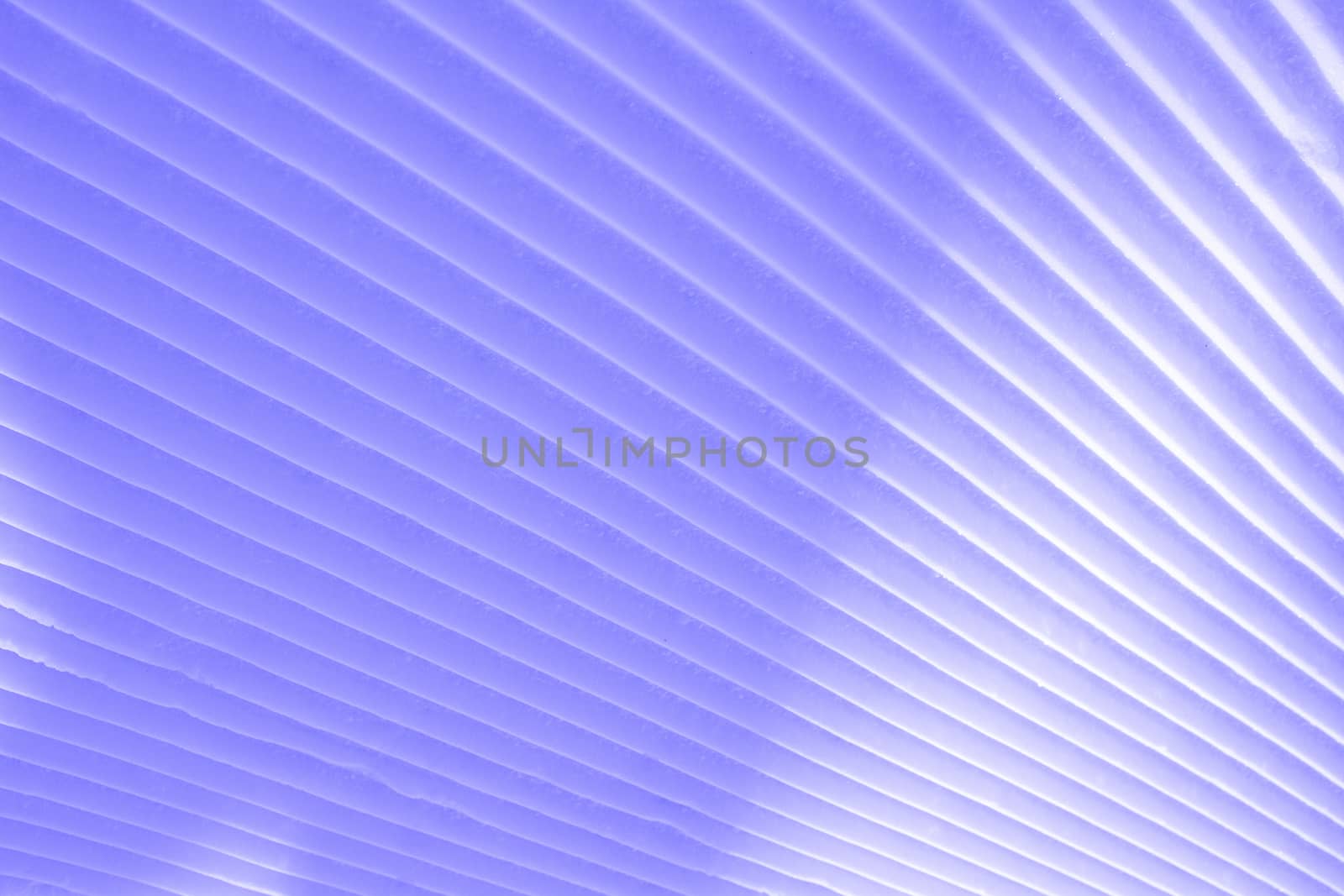 Background of diagonal geometrical parallel stripes of snow colored with light shade