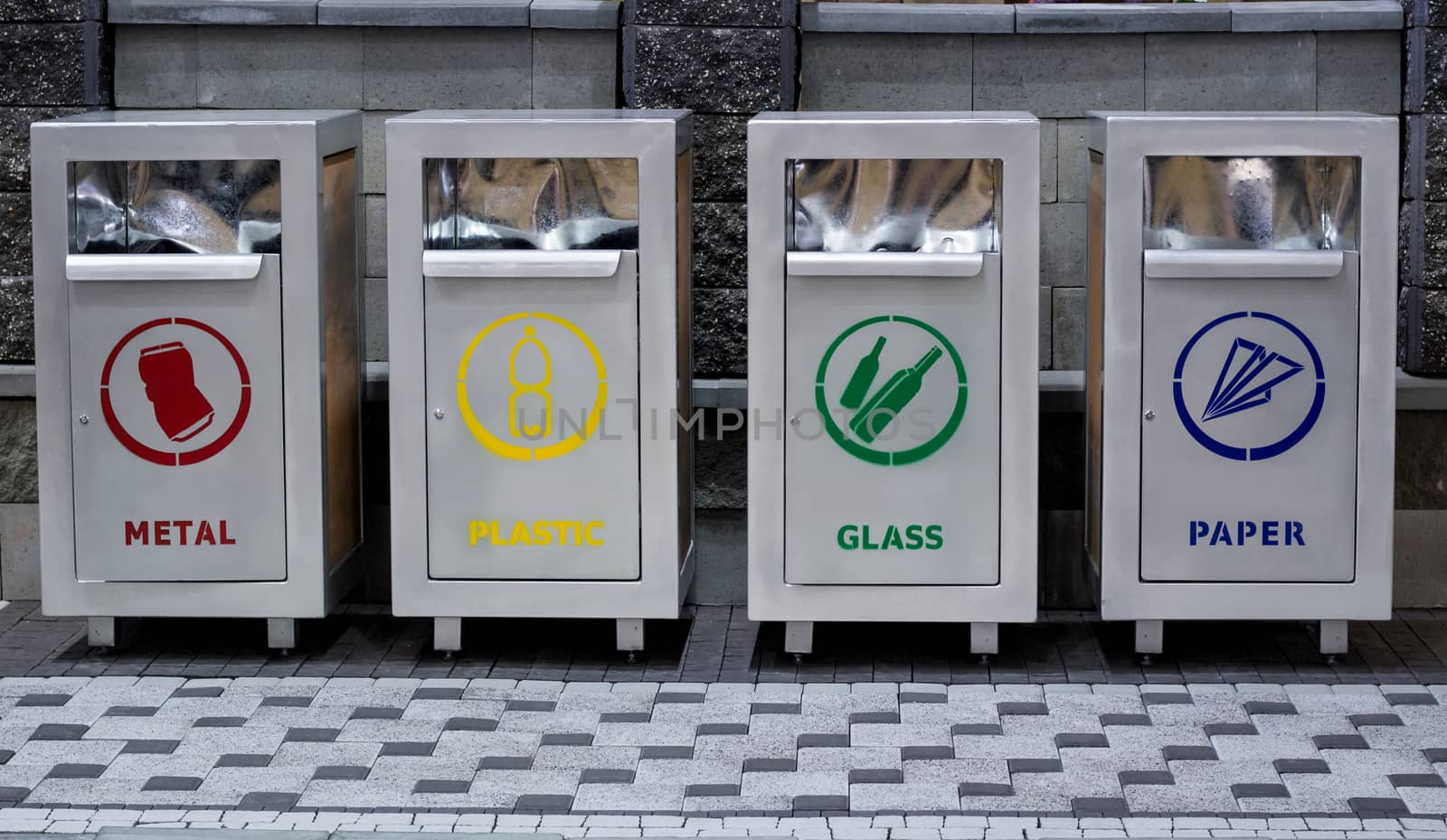 Urban trash recycling containers separating garbage: paper, metal, glass, plastic