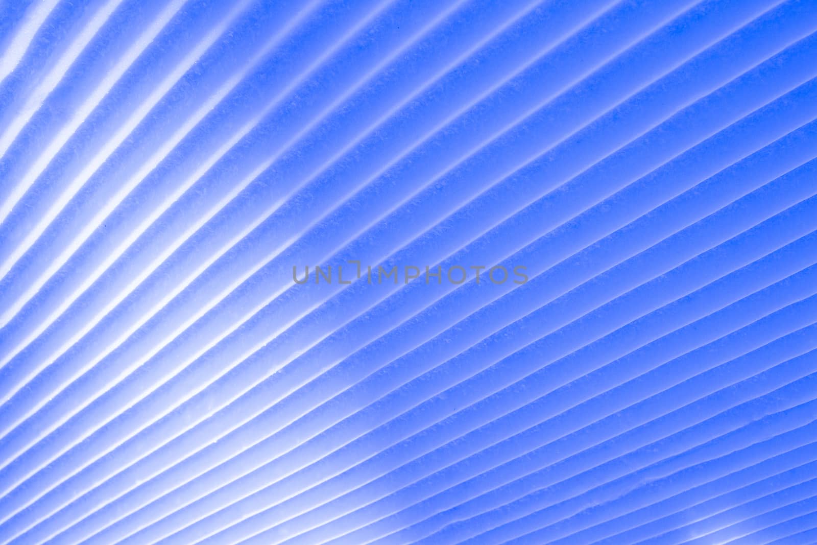 Background of diagonal geometrical parallel stripes of snow colored with light shade