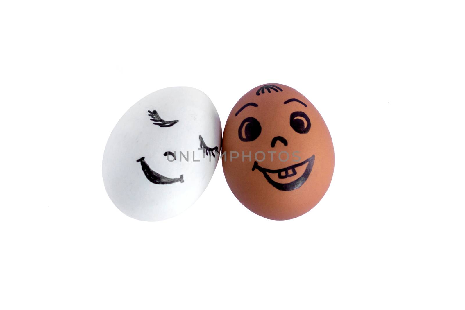 Funny eggs imitating a couple of happy smiling lovers on white background