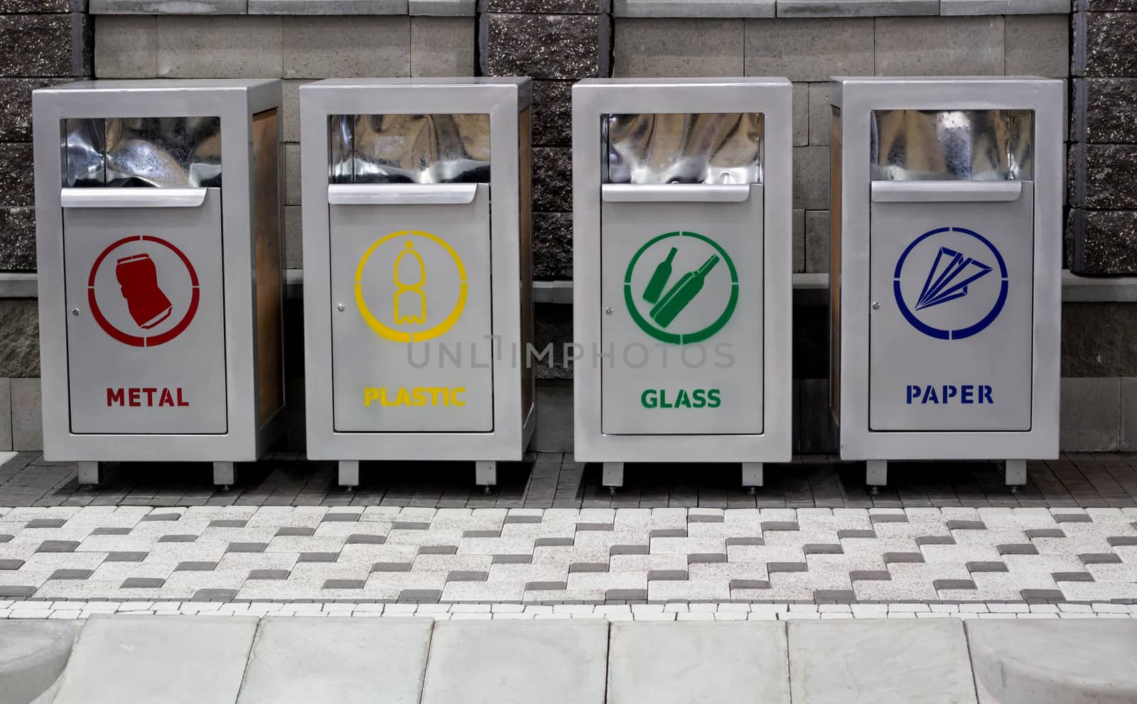 Urban trash recycling containers separating garbage: paper, metal, glass, plastic