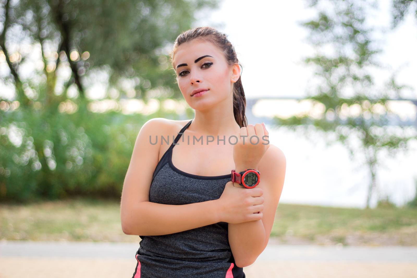Young fitness girl poses during workout exercises by VeraVerano