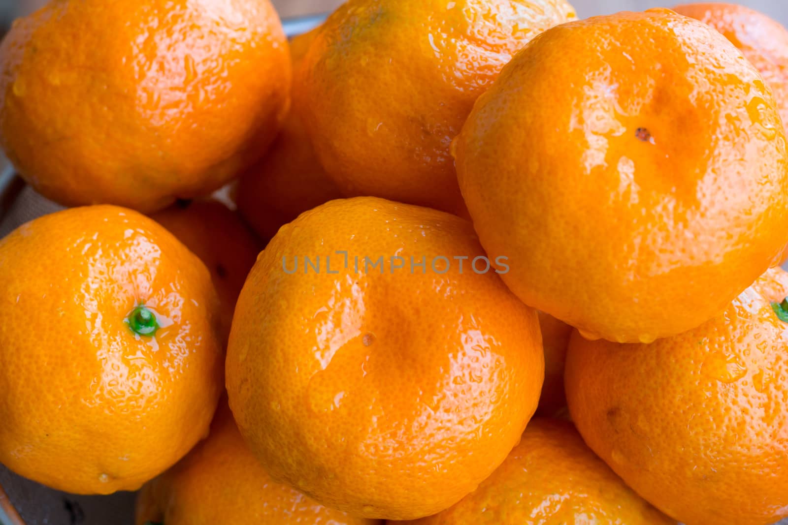 Close up of wet juicy citrus orange mandarins
