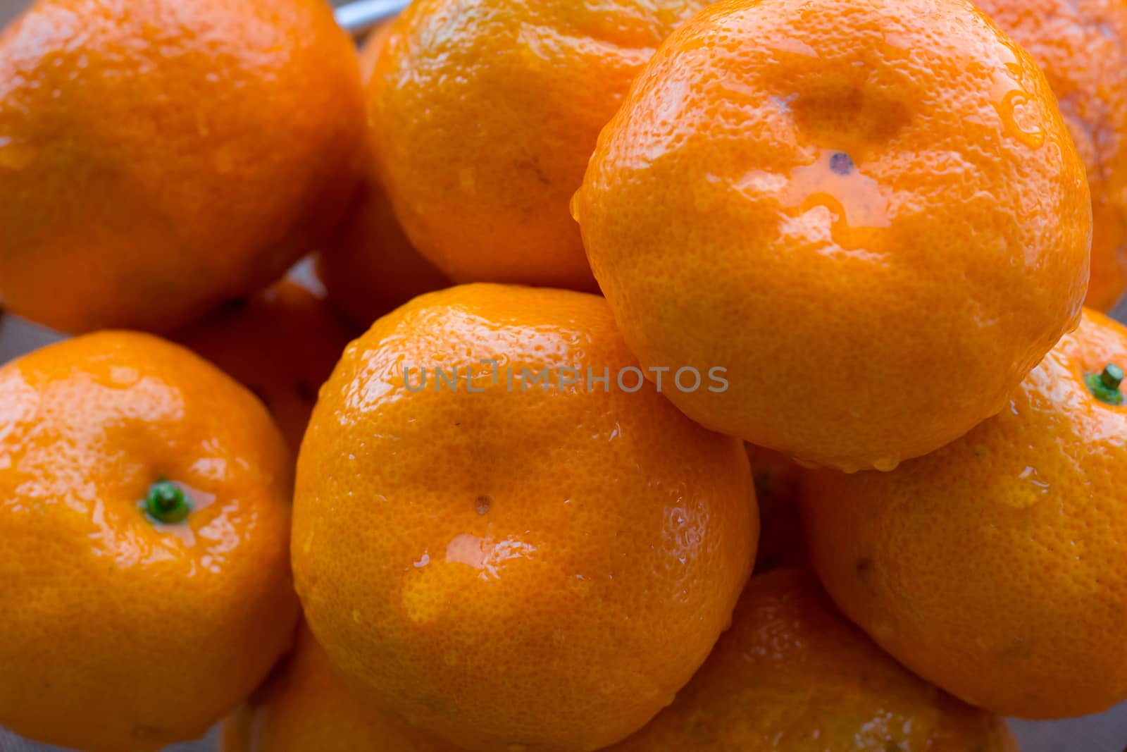Close up of wet juicy orange citrus mandarins
