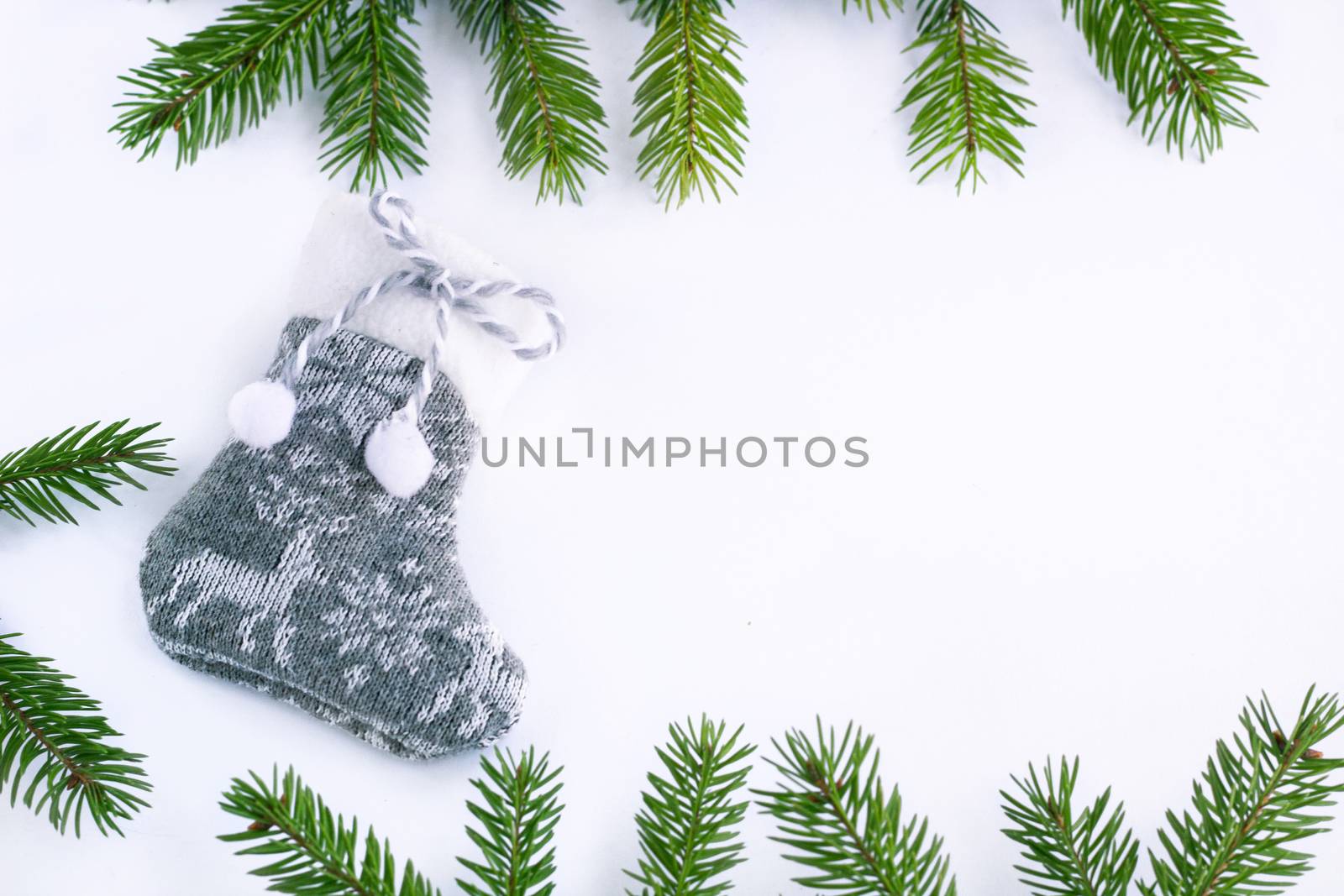 Gray Christmas stocking sock on white background, frame of green by VeraVerano