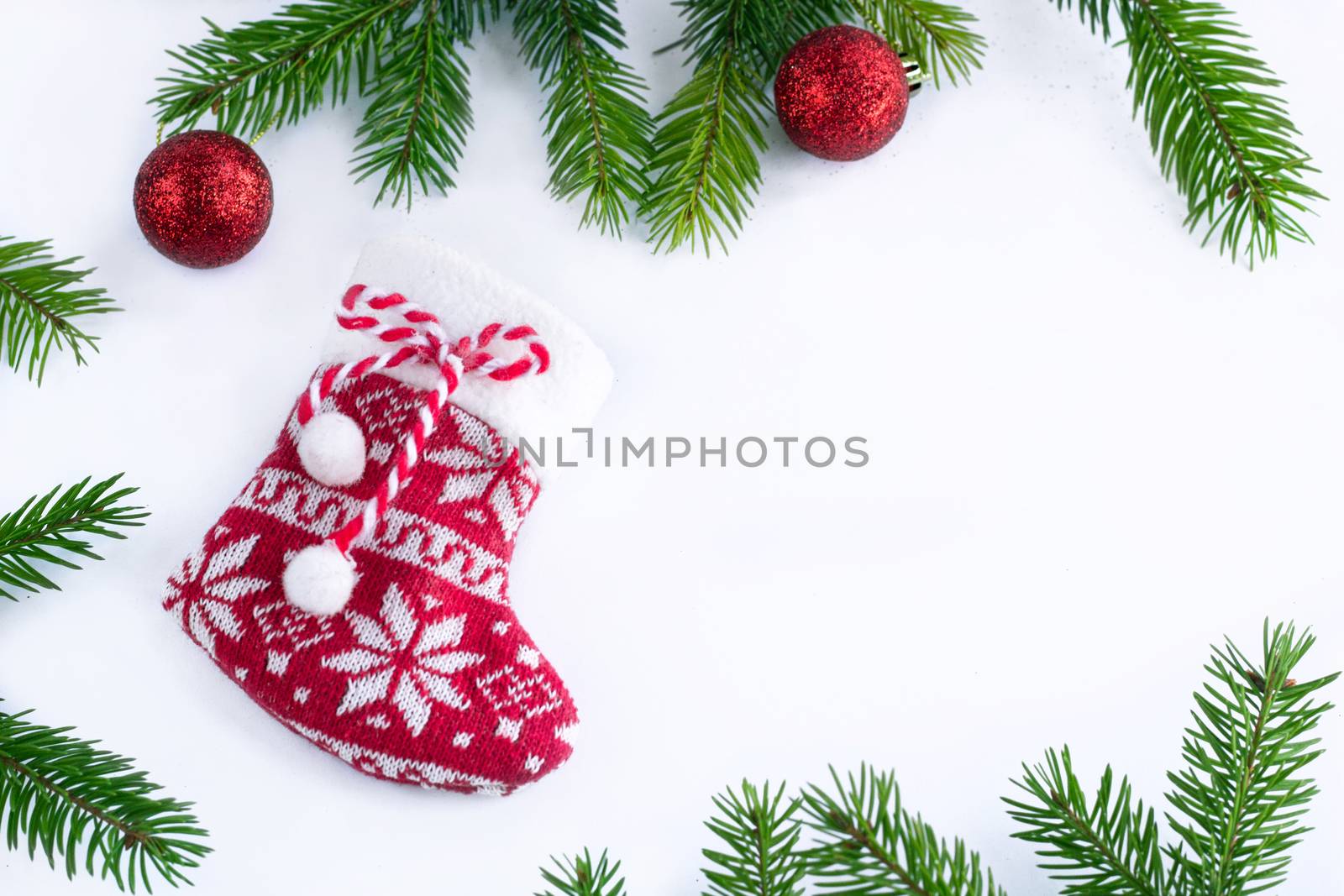 Red Christmas stocking sock and balls on white background, frame by VeraVerano