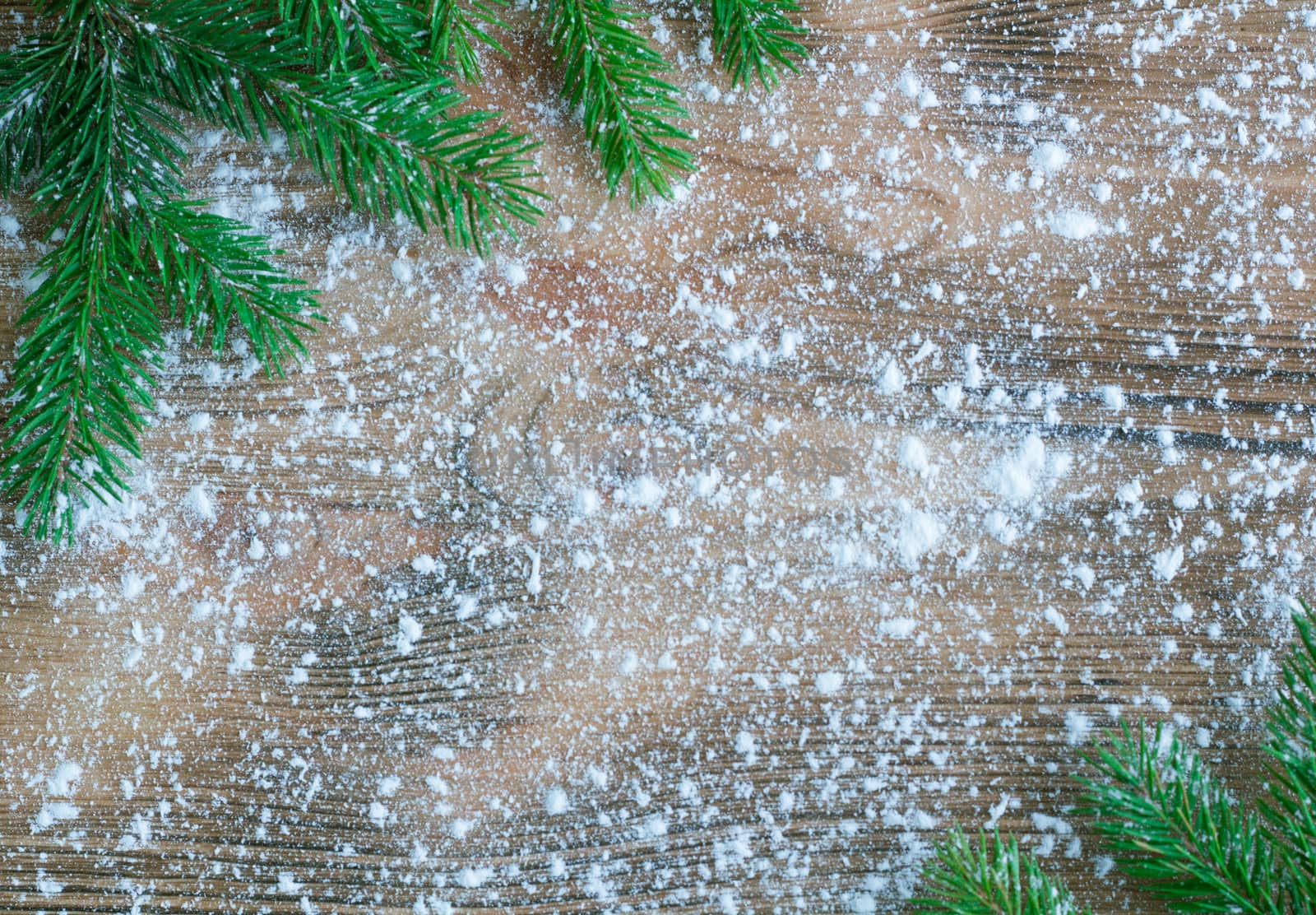 Christmas and New Year winter holiday snowbound wooden background with green fir tree branches