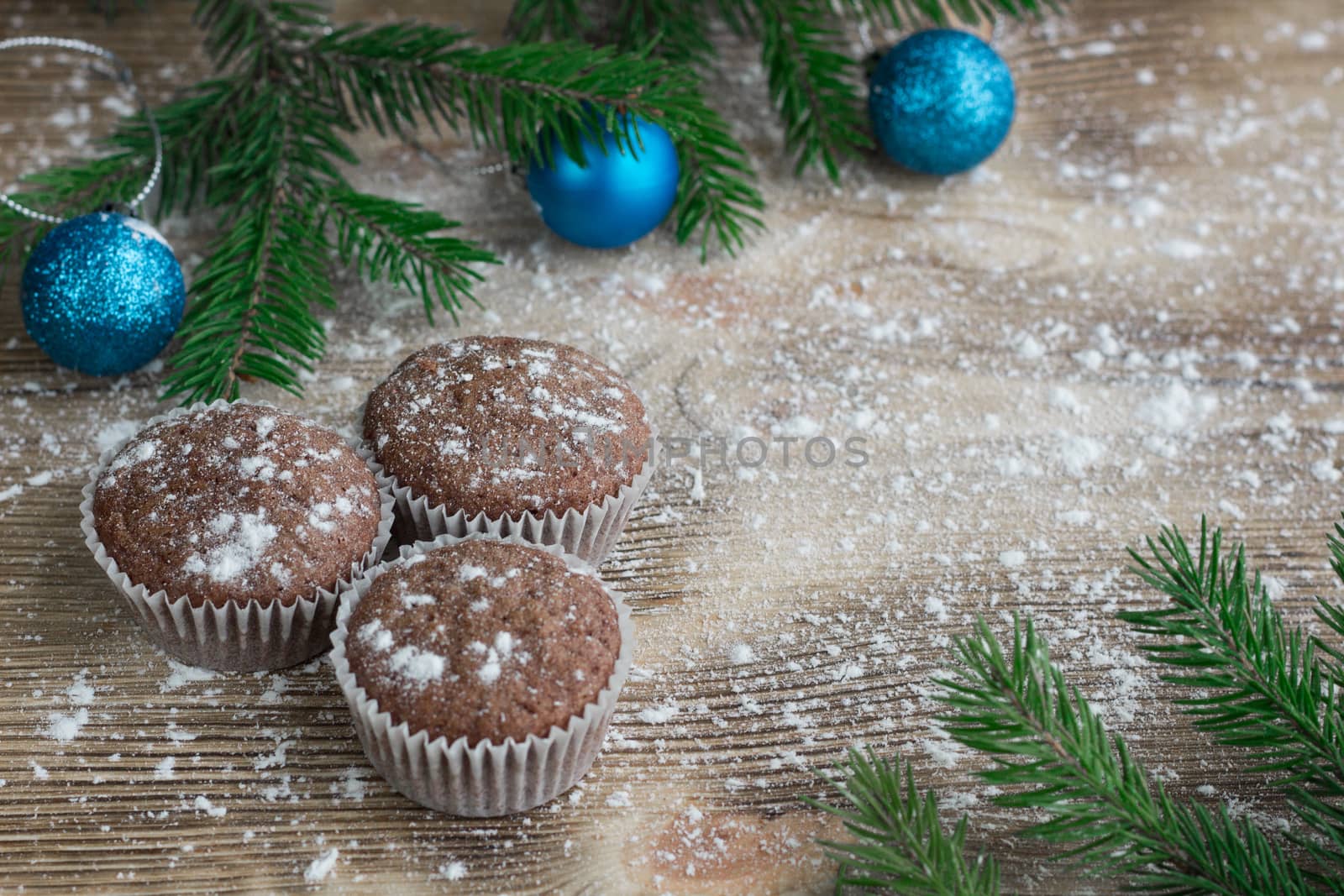 Three Christmas cakes, winter snowbound wooden background, blue  by VeraVerano