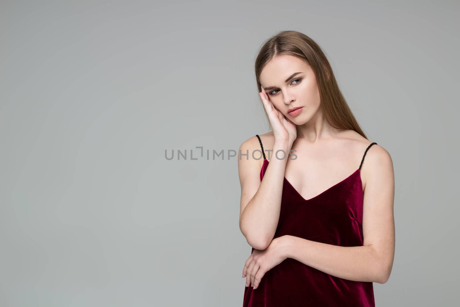 Blond girl in red dress poses showing emotions: wistfulness by VeraVerano