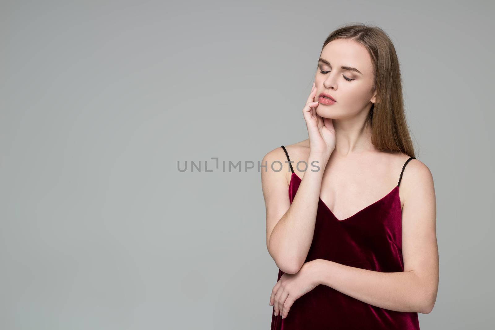 Blond girl in dark red poses showing emotions: wistfulness, drea by VeraVerano