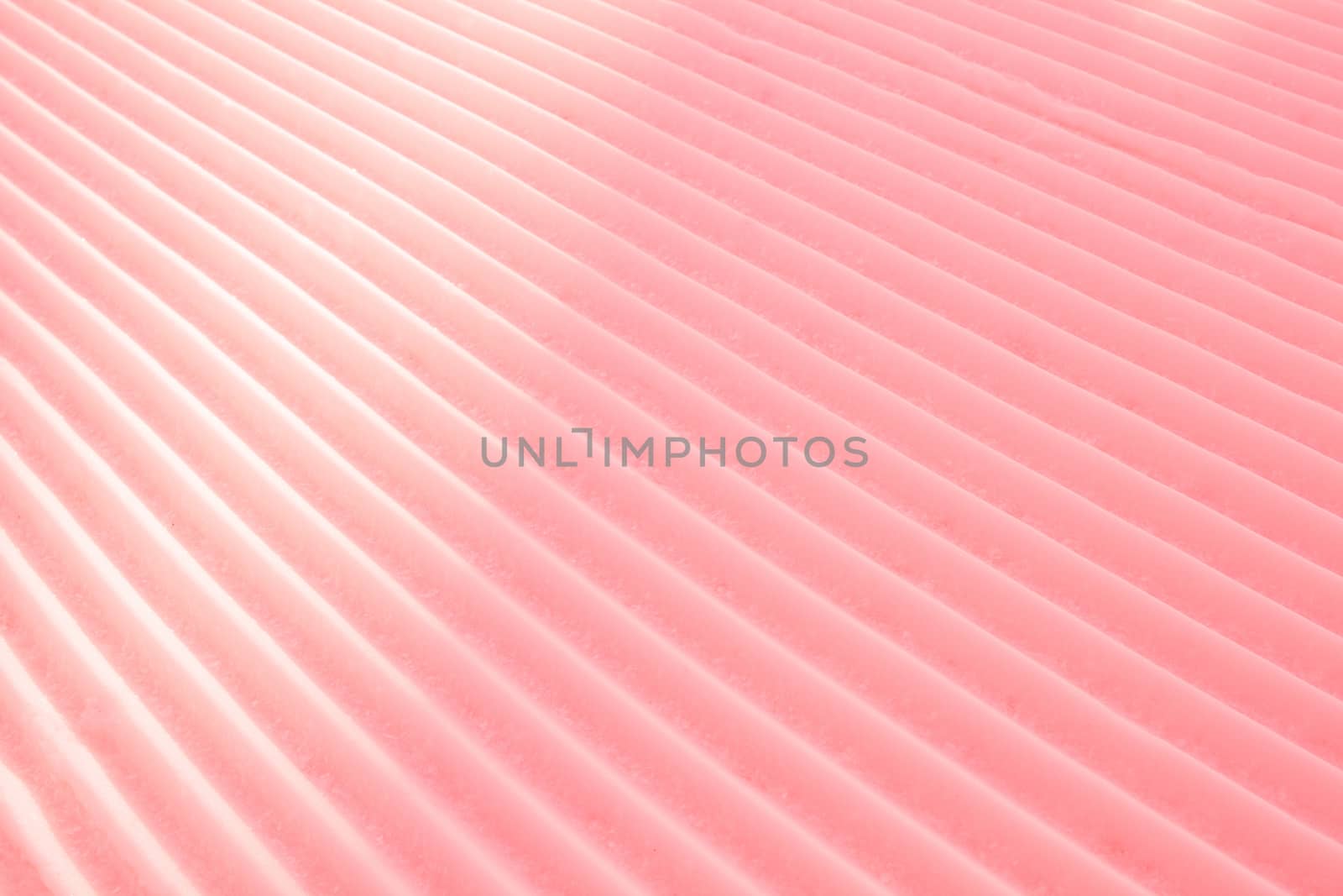 Background of diagonal geometrical parallel stripes of snow colored with light shade