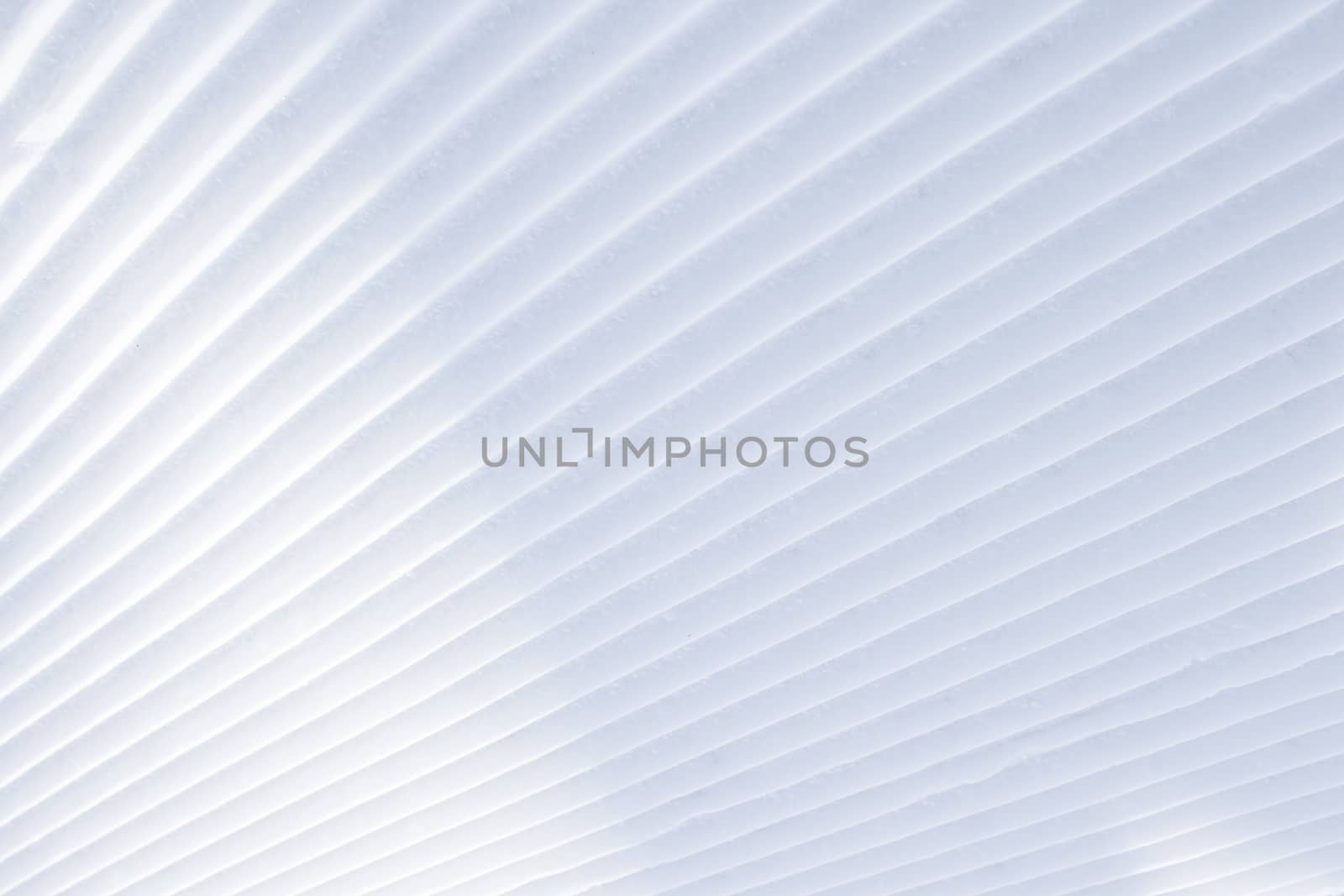 Diagonal parallel snow stripes background with light shadows by VeraVerano