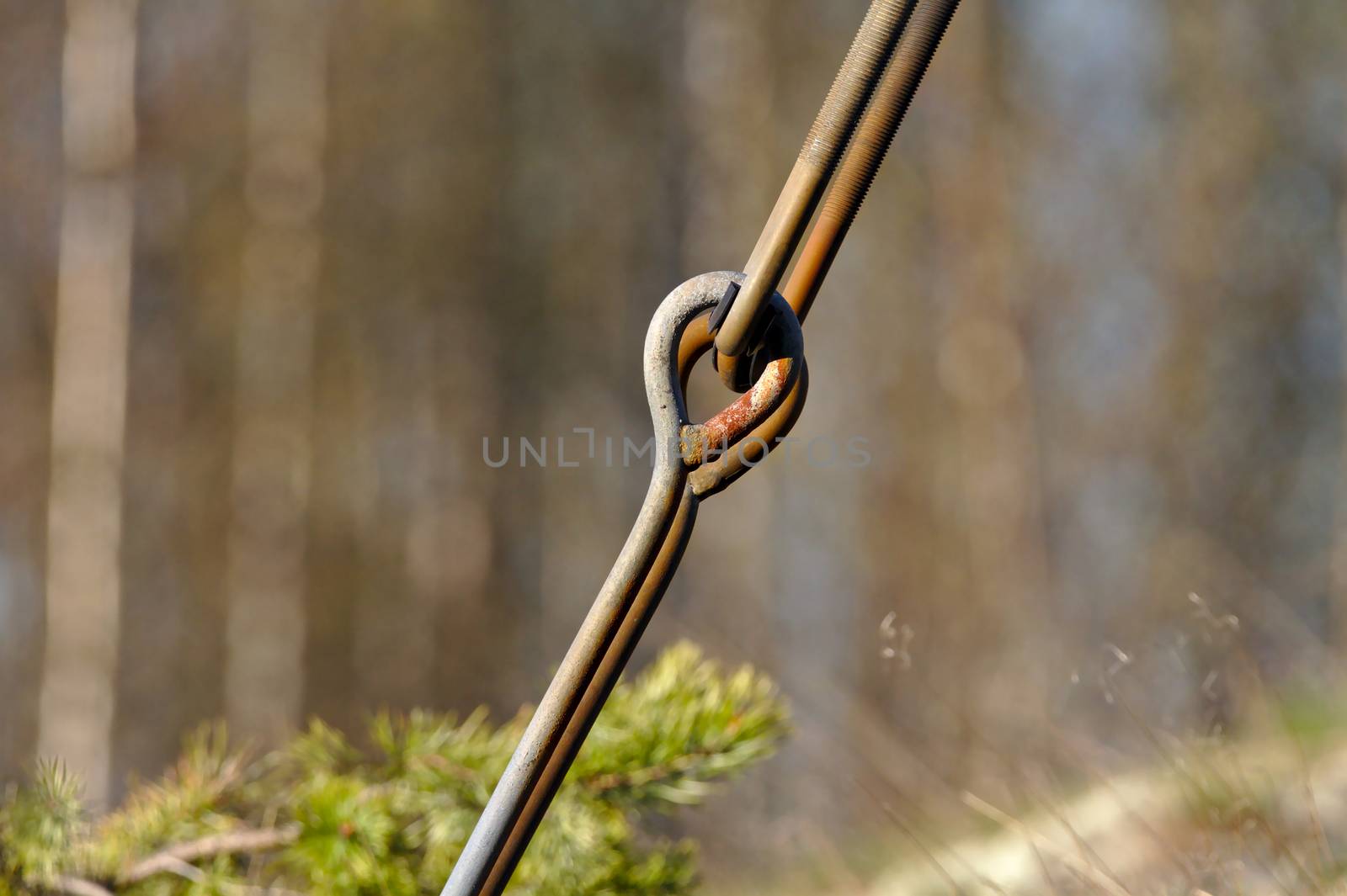 A strong steele connection rod holding up the tower of power lines