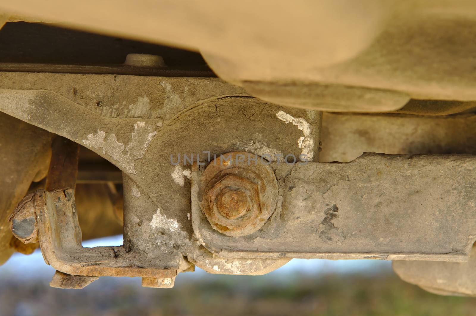 Rusty mount of a rear axle of a front wheel drive car. by Valokuva24