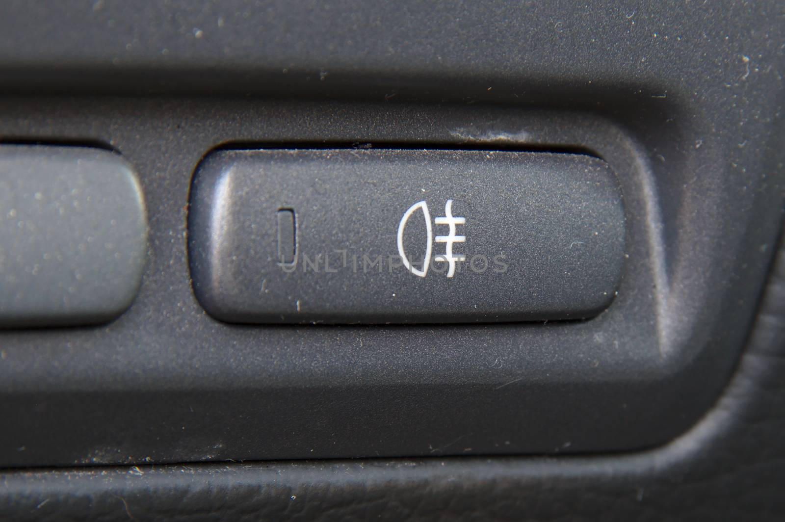 Rear fog lights switch in the dashboard of a car. by Valokuva24