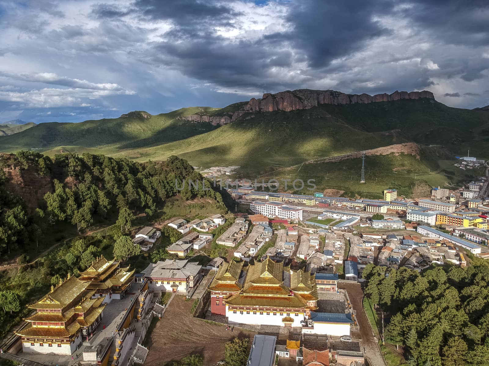 The bird-view of  Langmu Temple with rainbow and Red Cliff in the Zoige County,Sichuan Province,and Luqu County,Gannan Tibetan Prefecture,Gansu Province.