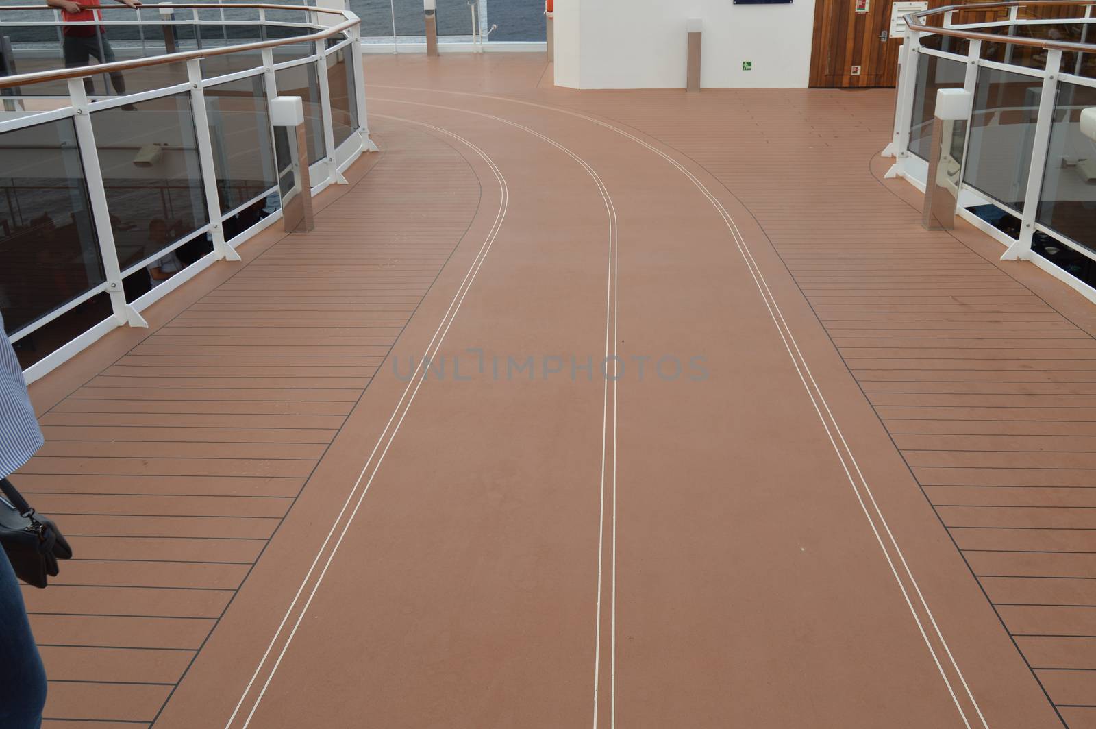 Red treadmill on the upper deck of the cruise ship.