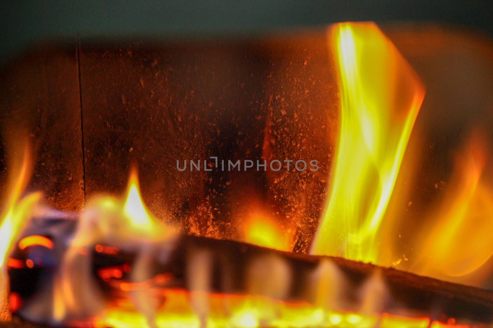 wood log in a fire place by nenovbrothers