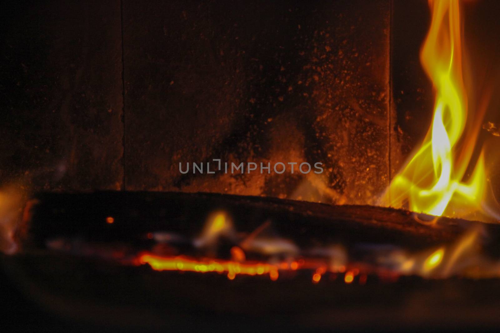 wood log in a fire place by nenovbrothers