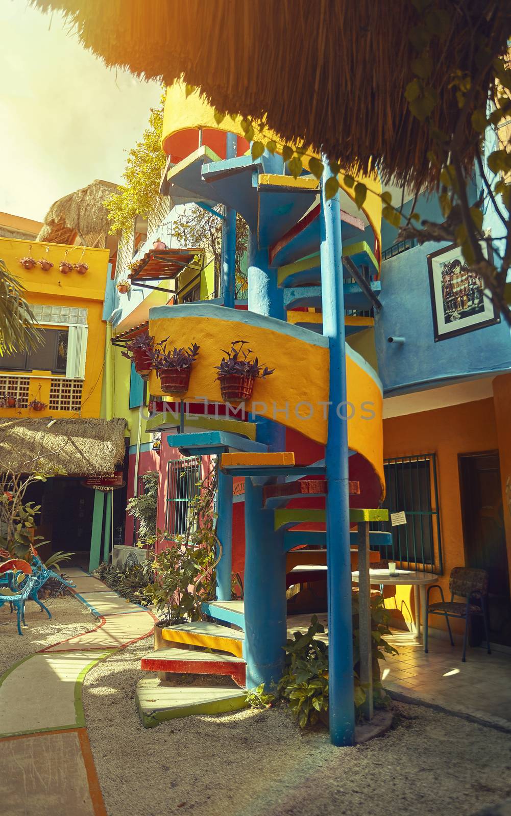 Colorful spiral staircase belonging to a typical building of the city of Playa del Cramen in Mexico.