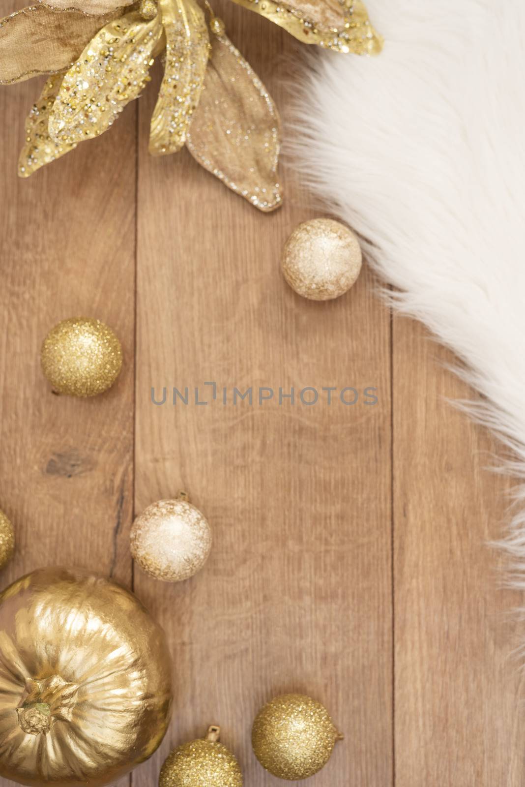 Christmas background. Gold Christmas balls on a wooden background. Winter holidays concept. Top view with copy space, vertical image by sevda_stancheva