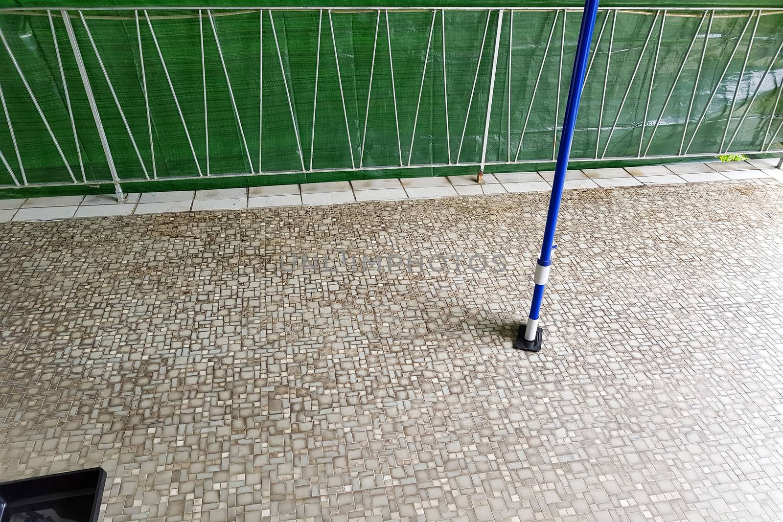 Balcony floor tiles installation. Laying tiles from porcelain. Interior remodeling theme.