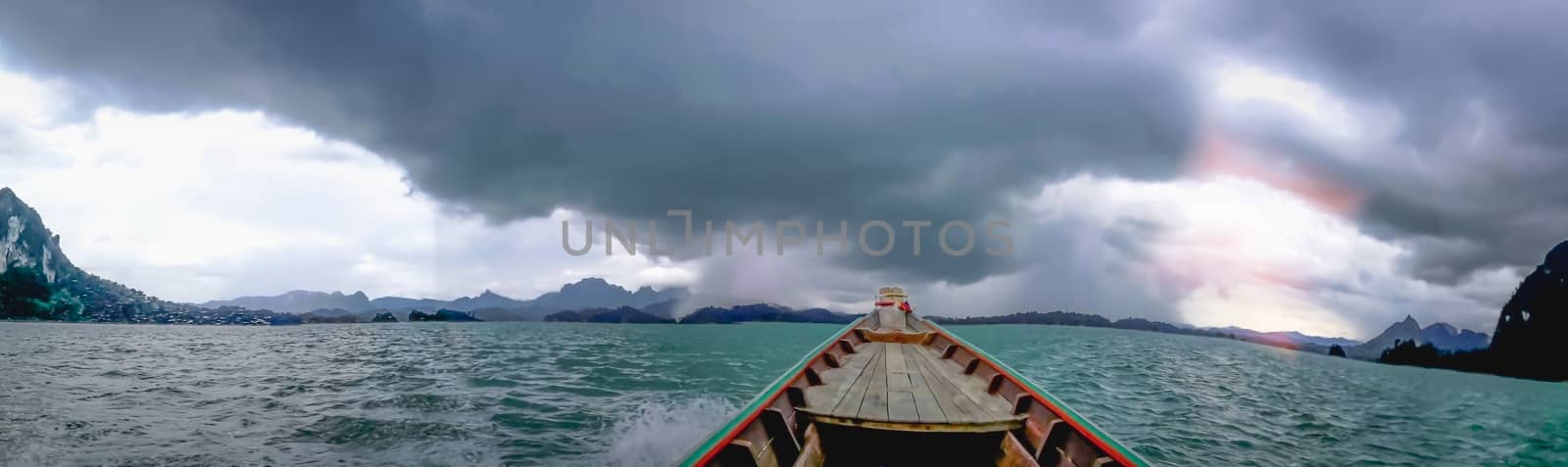 Blue sky green sea boat and mountain