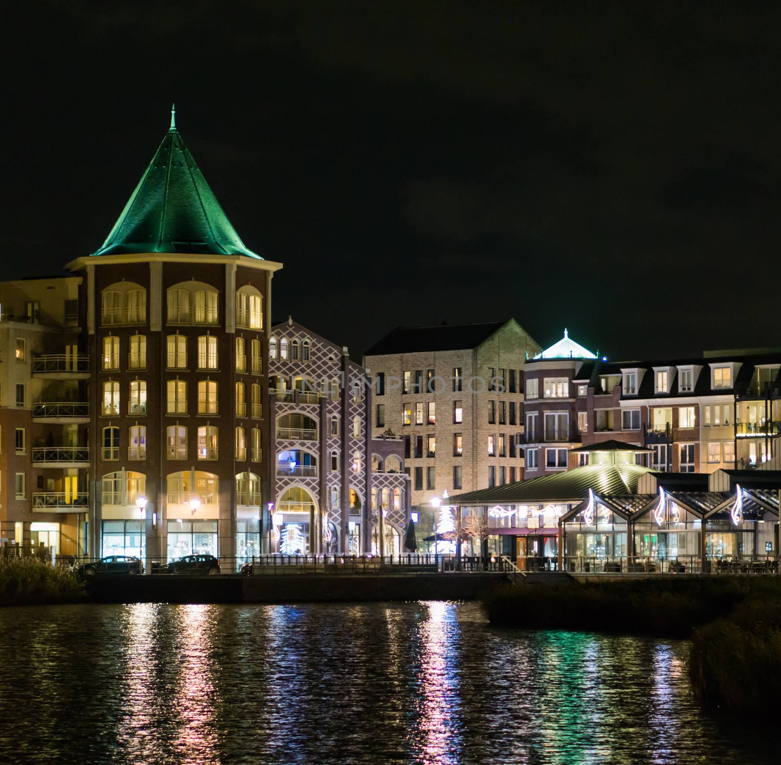 city center vleuterweide in the Meern, Utrecht, The netherlands, beautiful view from the water looking on all the buildings by charlottebleijenberg