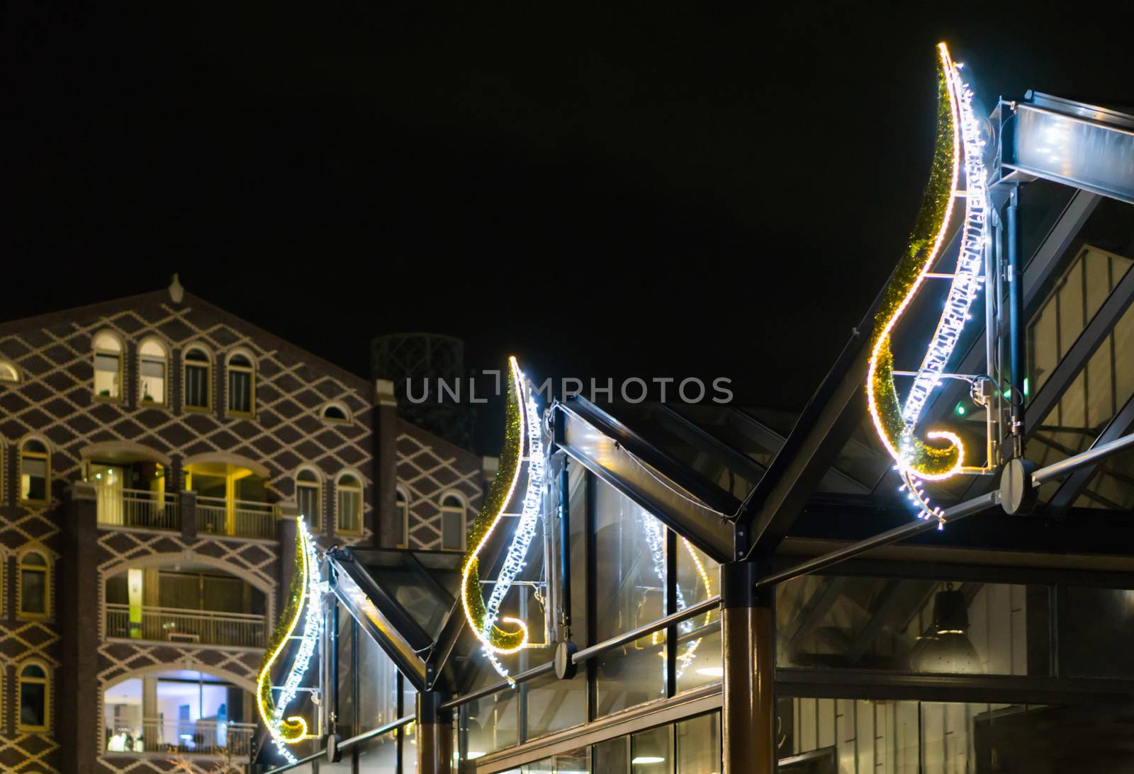 beautiful christmas light decorations on buildings to decorate the city streets at night