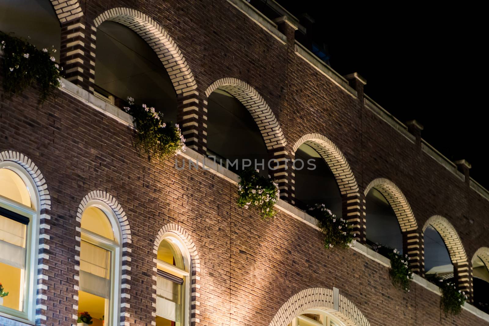 beautiful arched balcony's decorated with flowers modern dutch architecture