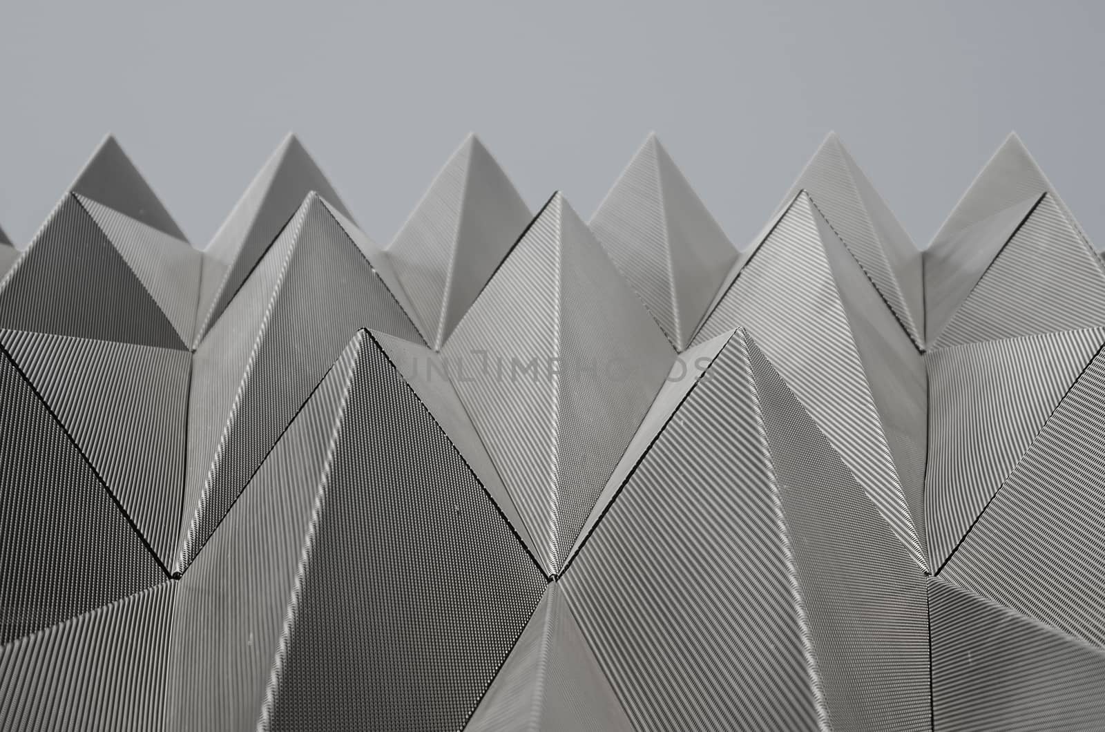 Metallic piramids make the faces of the Navarrabiomed building near the hospital of Pamplona, Navarra, Spain
